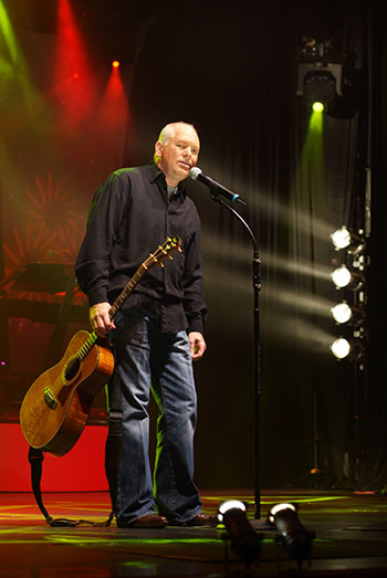 Calvin Gilmore performing under stage lights